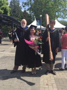 Ms. Ning Ding, 2015 Governor General's Silver Medal in Arts winner (centre), with Prof. Hugh Neary (left), VSE Assistant Director and BA (Econ) Program Coordinator, and (right) Prof. Thomas Lemieux, VSE Director.  Dr. Lemieux holds the UBC Ceremonial Mace.